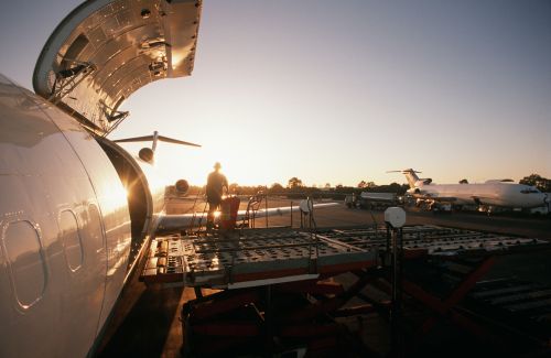 Loading on an airplane in the evening sun