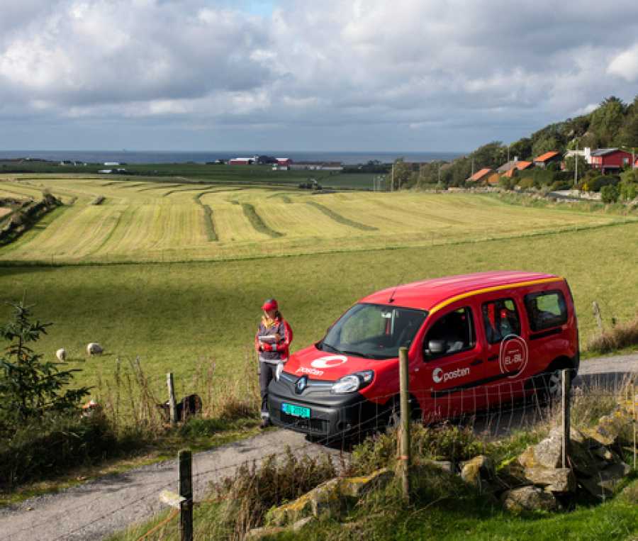 Posten car and mailman in the countryside