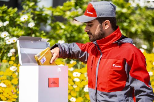 Mailman empties mail box