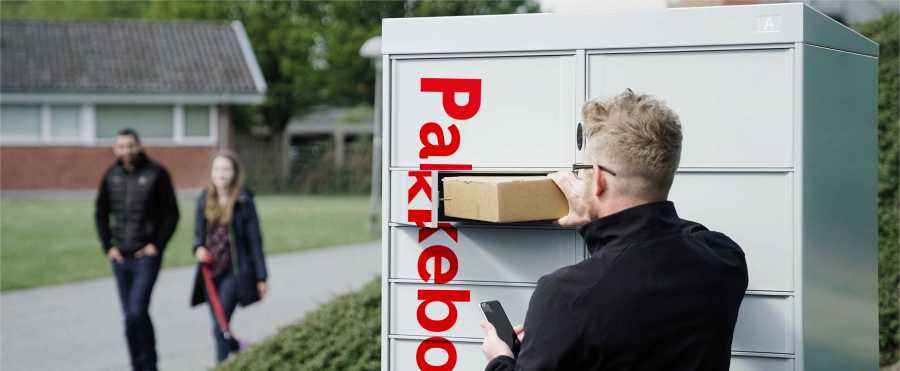 Man collects package from parcel locker